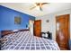 Bedroom featuring a king bed, wood floors, and two-toned walls at 960 Cameron St, Indianapolis, IN 46203