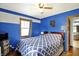 Bedroom with a king bed, two-toned walls and a ceiling fan at 960 Cameron St, Indianapolis, IN 46203