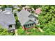 Aerial view of home featuring manicured lawn, brick foundation, garden and a light grey shingled roof at 960 Cameron St, Indianapolis, IN 46203
