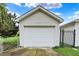 Detached one car garage with modern white garage door at 960 Cameron St, Indianapolis, IN 46203