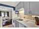 Charming kitchen featuring gray cabinets, marble countertops, and stainless steel appliances at 960 Cameron St, Indianapolis, IN 46203