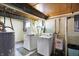 Functional laundry room with washer, dryer, and utility sink at 960 Cameron St, Indianapolis, IN 46203