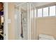 Bathroom featuring a glass enclosed shower, tile surround, and updated fixtures at 960 Cameron St, Indianapolis, IN 46203