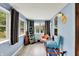 Sunroom with ample natural light, light blue walls, and modern decor at 960 Cameron St, Indianapolis, IN 46203