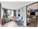 Cozy sunroom featuring neutral flooring, light blue walls, and comfortable seating at 960 Cameron St, Indianapolis, IN 46203