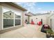 Private backyard patio with outdoor seating, view of the neighboring property and sliding glass door at 112 Bridgemor Ln, Mooresville, IN 46158