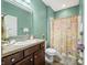 Bathroom featuring single sink vanity, framed mirror, neutral countertops and walk in shower at 112 Bridgemor Ln, Mooresville, IN 46158
