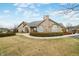 Community clubhouse exterior, featuring well maintained lawn, flag pole and plenty of parking at 112 Bridgemor Ln, Mooresville, IN 46158