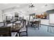 Community room with fireplace, multiple tables, chairs, and kitchenette for residents to enjoy at 112 Bridgemor Ln, Mooresville, IN 46158