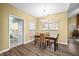 Bright dining room with large window, perfect for Gathering meals and entertaining at 112 Bridgemor Ln, Mooresville, IN 46158