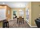 Cozy dining area with modern chandelier and natural light, open to the living room and kitchen at 112 Bridgemor Ln, Mooresville, IN 46158