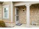 Close-up of the home's front entrance, showing a covered porch and stone detailing at 112 Bridgemor Ln, Mooresville, IN 46158