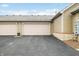 Attached two-car garage with paved driveway and well-maintained exterior at 112 Bridgemor Ln, Mooresville, IN 46158