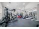 Well-lit fitness area with various exercise equipment and a mirrored wall at 112 Bridgemor Ln, Mooresville, IN 46158