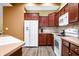Spacious kitchen featuring updated appliances, ample cabinetry, and a stylish backsplash at 112 Bridgemor Ln, Mooresville, IN 46158