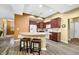 Spacious kitchen featuring laminate countertops, stainless appliances, and a breakfast bar at 112 Bridgemor Ln, Mooresville, IN 46158