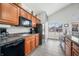 Cozy kitchen area with black appliances and lots of cabinet space at 112 Bridgemor Ln, Mooresville, IN 46158