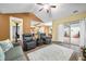 Open-concept living area with wood-look floors and direct access to the backyard at 112 Bridgemor Ln, Mooresville, IN 46158