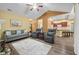 Open-concept living room with vaulted ceilings, comfortable seating, and wood-look flooring at 112 Bridgemor Ln, Mooresville, IN 46158