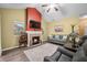 Bright living room with vaulted ceilings, a fireplace, and comfortable seating at 112 Bridgemor Ln, Mooresville, IN 46158