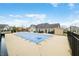 Community pool is closed for the season, featuring a blue cover, fencing and patio chairs at 112 Bridgemor Ln, Mooresville, IN 46158