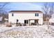 Large backyard featuring a patio with outdoor seating and snow covered lawn at 11835 Bengals Dr, Fishers, IN 46037