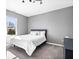 Bright bedroom with a large window, carpeted floors, and neutral gray walls at 11835 Bengals Dr, Fishers, IN 46037