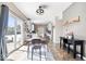 Bright dining area featuring an open layout, stylish lighting and an adjacent kitchen area at 11835 Bengals Dr, Fishers, IN 46037