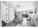 Elegant entryway with beautiful tile flooring, staircase and a view to the living room at 11835 Bengals Dr, Fishers, IN 46037
