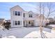 Attractive two-story home with a two-car garage and snow covered front yard at 11835 Bengals Dr, Fishers, IN 46037
