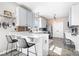 Kitchen featuring sleek countertops, modern lighting and an adjacent breakfast bar at 11835 Bengals Dr, Fishers, IN 46037