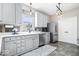 A well-lit kitchen featuring sleek countertops, stainless steel appliances, and stylish lighting at 11835 Bengals Dr, Fishers, IN 46037