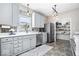 A kitchen with stainless steel appliances, modern cabinets, and a walk-in pantry at 11835 Bengals Dr, Fishers, IN 46037