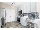 A kitchen with stainless steel appliances and a built-in desk area at 11835 Bengals Dr, Fishers, IN 46037