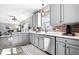 Bright kitchen with stainless steel appliances, modern cabinets, and an open layout to the dining/living areas at 11835 Bengals Dr, Fishers, IN 46037