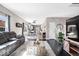 Open living space with a comfortable couch, wood floors, and views to the kitchen at 11835 Bengals Dr, Fishers, IN 46037