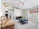 Comfortable living room with vaulted ceilings, natural light, and neutral-toned walls, and plush carpet at 11835 Bengals Dr, Fishers, IN 46037
