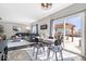 Open-concept living space with a dining area and access to the backyard at 11835 Bengals Dr, Fishers, IN 46037