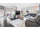 Comfortable living room with a large gray sectional couch and wood floors at 11835 Bengals Dr, Fishers, IN 46037