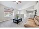 Inviting living room with a large window, high ceilings, comfortable seating, and neutral-toned walls at 11835 Bengals Dr, Fishers, IN 46037