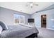 Spacious main bedroom with large window, plush carpet, and a walk-in closet at 11835 Bengals Dr, Fishers, IN 46037