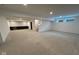 Finished basement with carpet, bar area, and staircase leading upstairs, perfect for entertaining or relaxing at 1225 Amberley Way, Westfield, IN 46074