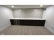 Basement bar area featuring a counter, beverage fridge, and dark cabinetry against a tile backsplash at 1225 Amberley Way, Westfield, IN 46074