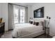 Neutral bedroom with a large window, decorative wall art and neutral decor at 1225 Amberley Way, Westfield, IN 46074