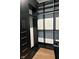 Walk-in closet with dark wood shelving and drawers providing ample storage and organization options at 1225 Amberley Way, Westfield, IN 46074