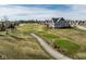 Picturesque view of golf course with walking path, residences, and small pond in the distance at 1225 Amberley Way, Westfield, IN 46074