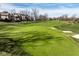 Scenic view of a lush golf course with green, sand traps, and surrounding residential homes at 1225 Amberley Way, Westfield, IN 46074