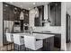 Modern kitchen featuring a large island, pendant lighting, and stainless steel appliances at 1225 Amberley Way, Westfield, IN 46074