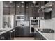 Contemporary kitchen boasts stainless steel appliances, elegant backsplash, and plenty of cabinet space at 1225 Amberley Way, Westfield, IN 46074