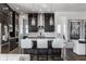 Stylish kitchen with an island, pendant lights, and stainless steel appliances open to living area at 1225 Amberley Way, Westfield, IN 46074